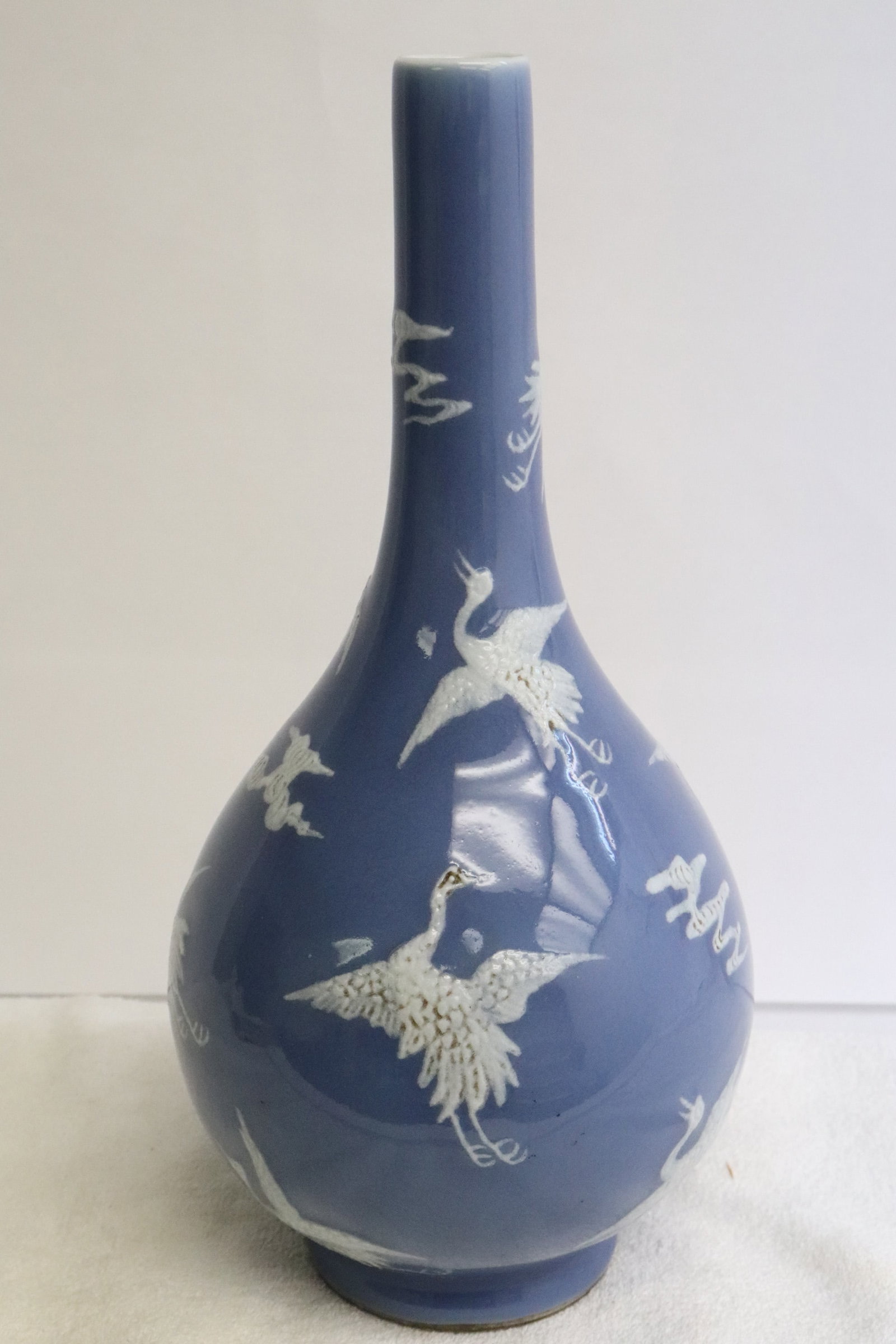 Chinese white on blue porcelain vase: Chinese white on blue porcelain vase with crane motif decoration, 11.4"x5.65"dia