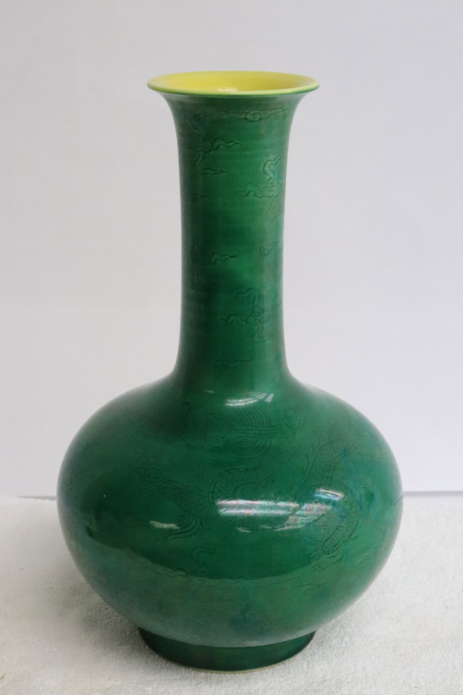 Fine green glazed porcelain vase: Fine green glazed porcelain vase embossed with dragon motif decoration, 9.6"x5.9"dia