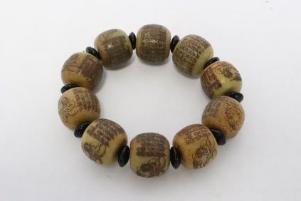 A stone bead bracelet with calligraphy
