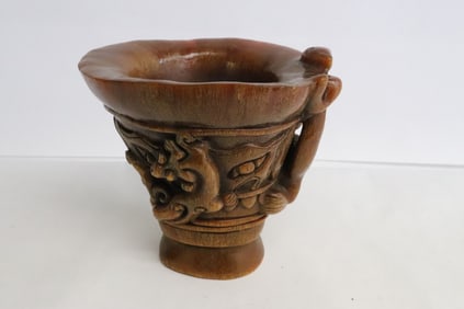 A horn style carved libation cup