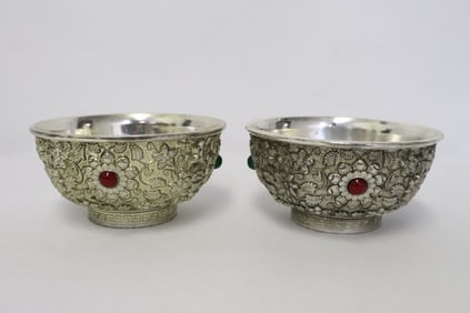 2 white bronze bowls with decoration in relief