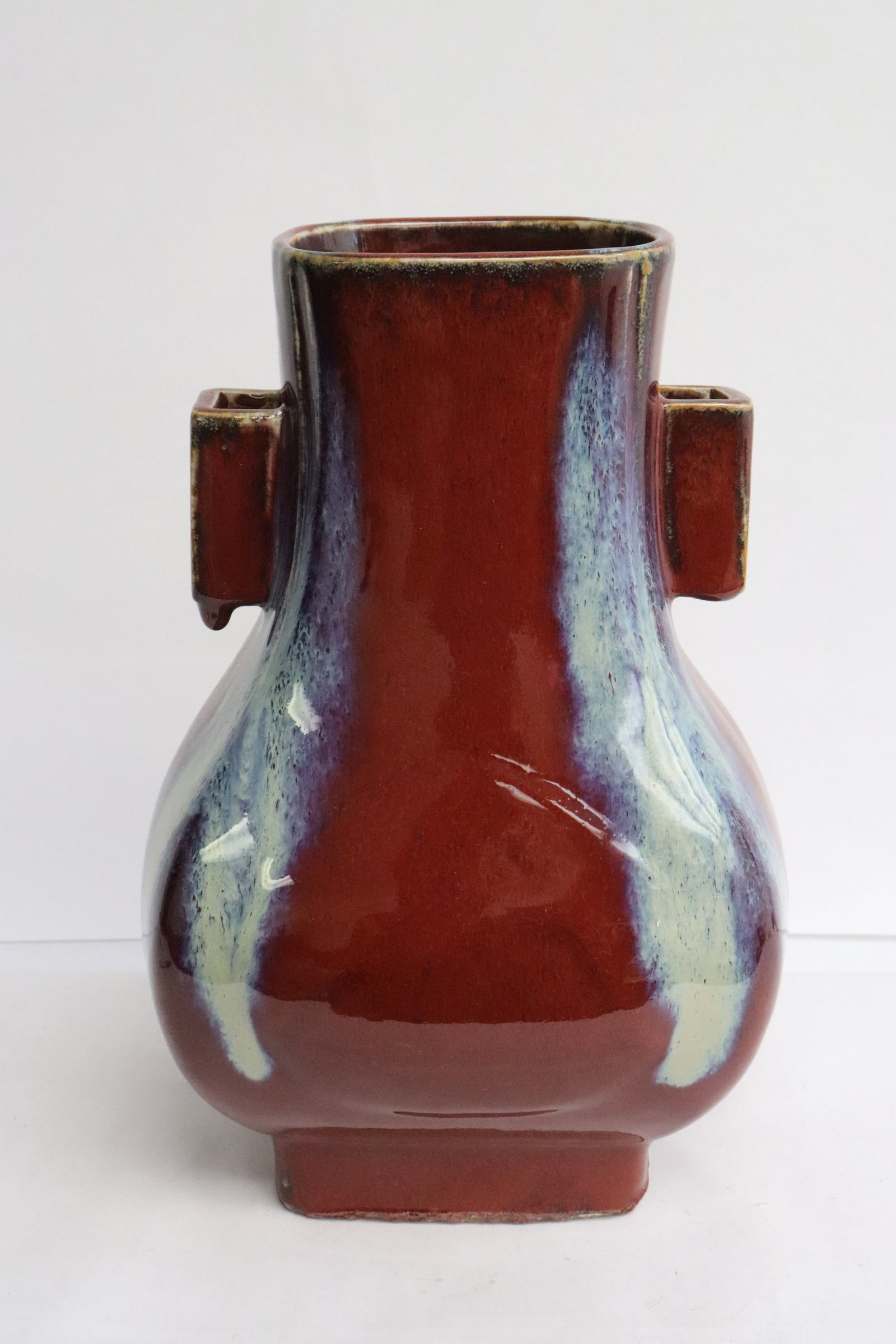 A blue on red rectangular porcelain jar: A blue on red rectangular porcelain jar, 10.9"x7.4"x6.3"