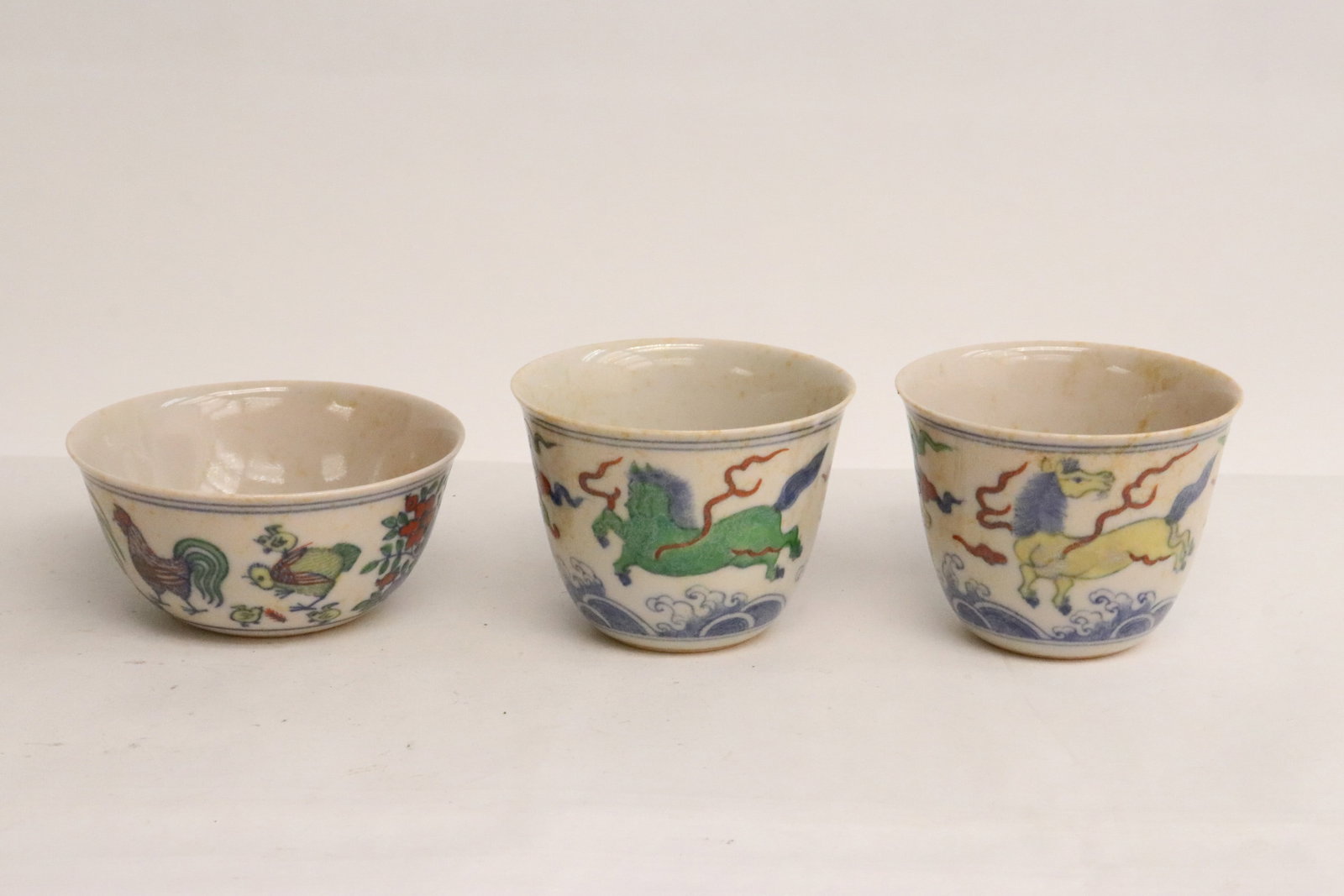 3 Chinese wucai porcelain tea bowls: 3 Chinese wucai porcelain tea bowls, 2.15"x2.8"dia - 1.5"x3.3"dia