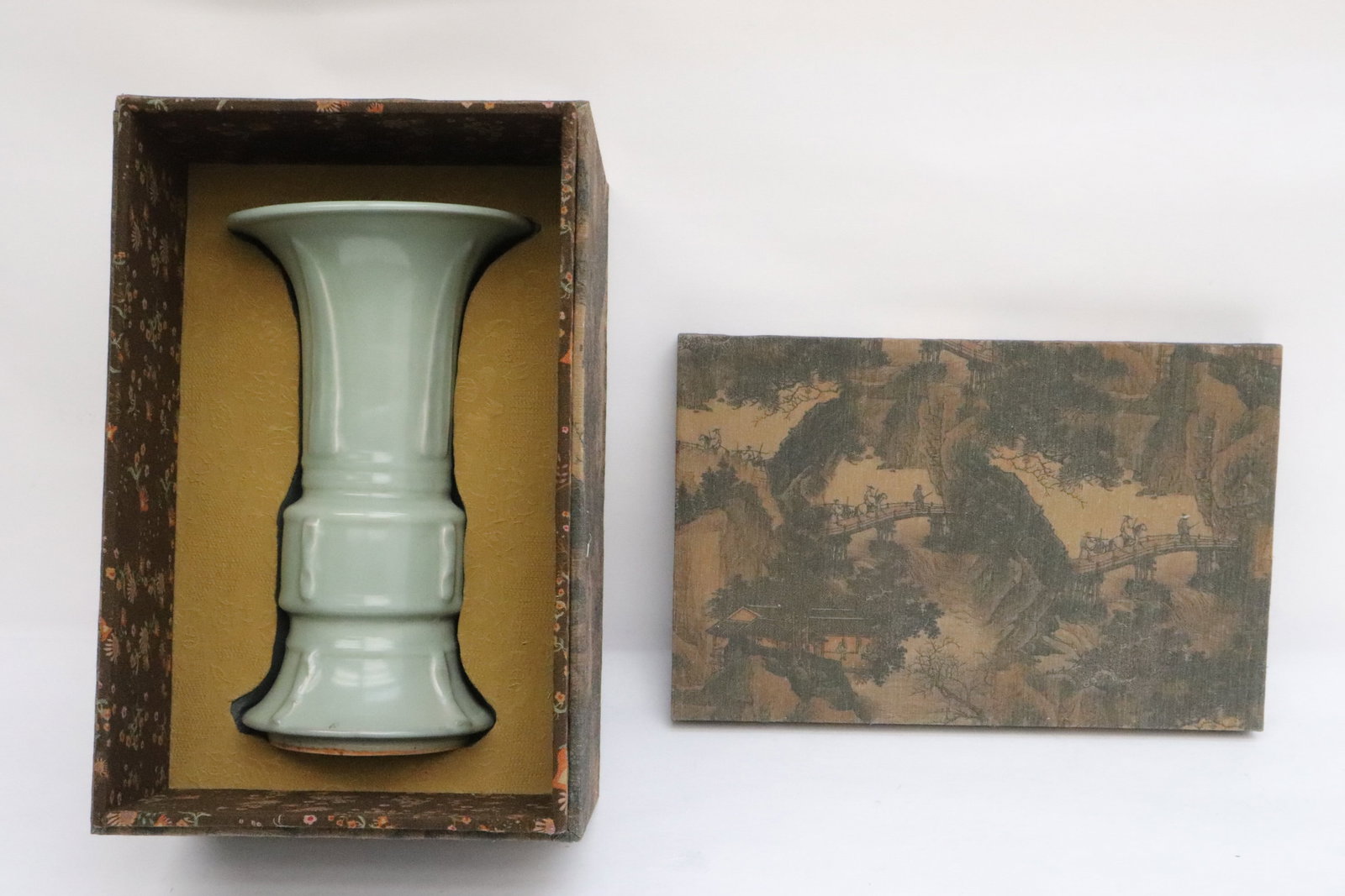 A light celadon gu shape porcelain vase: A light celadon gu shape porcelain vase, 11.4"x6.7"dia