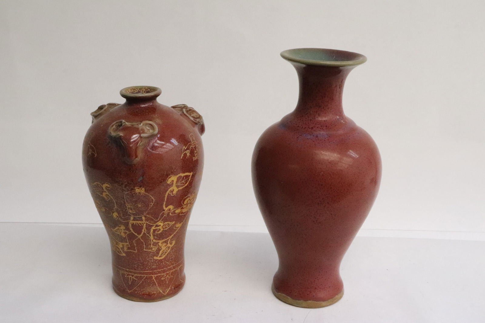 2 red glazed porcelain vases (1 of 10)