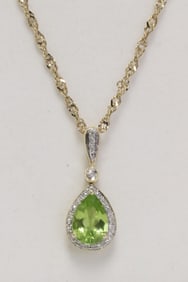 14K Y/G peridot diamond pendant w/ a 14K necklace