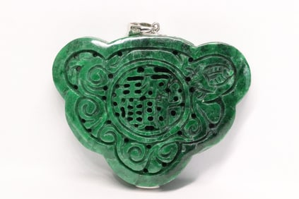 A jadeite pendant w/ GIA certificate & 18K W/G bale