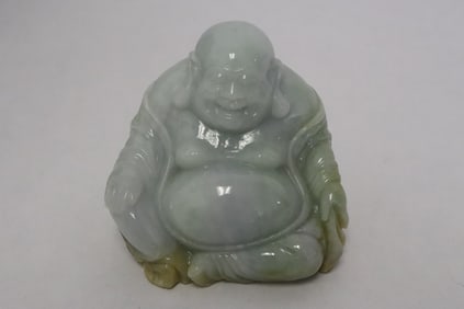 A jadeite carved deity with GIA certificate