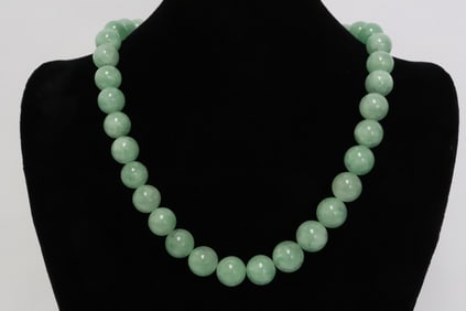 A light apple green jadeite bead necklace