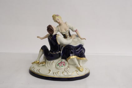 A Royal Dux porcelain figurine group