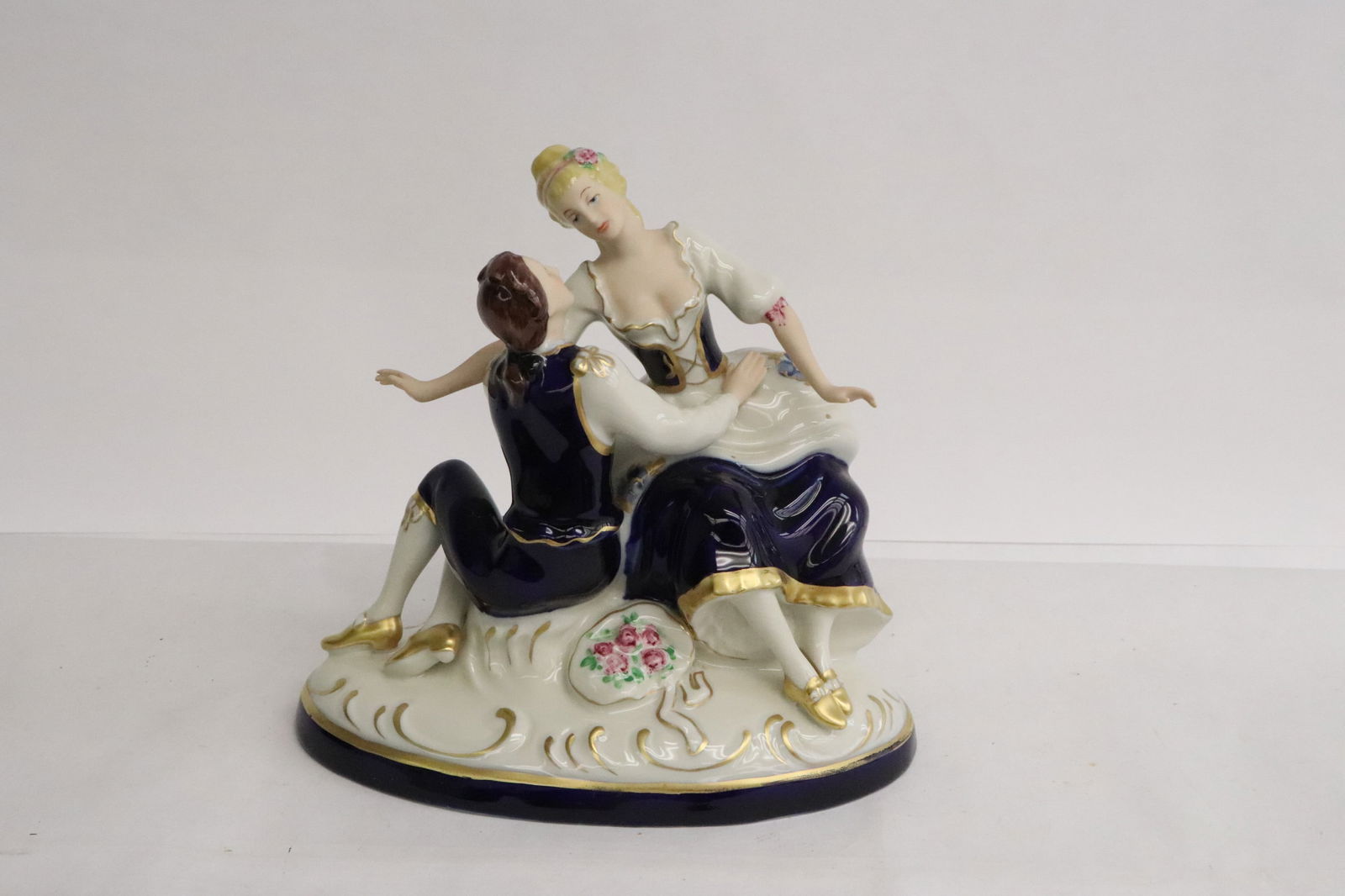 A Royal Dux porcelain figurine group: A Royal Dux porcelain figurine group, 7"H