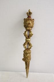 An extremely heavy Tibetan gilt bronze relic