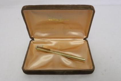 A 14K gold filled ball pen by Neiman Marcus