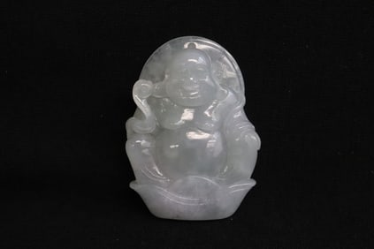 A lavender jadeite carved deity