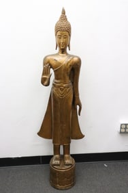 A South Asian life size gilt wood sculpture