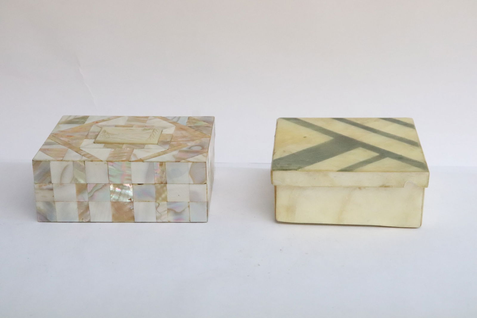2 mother of pearl overlay boxes; one with Chinese antique mother of pearl engraved gambling chip: 2 mother of pearl overlay boxes (1.65"x4.25"x4.25", 2"x4.8"x3.68"); one with Chinese antique mother of pearl engraved gambling chip