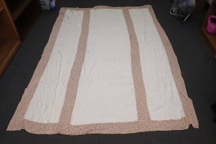 A beautiful lace and silk large table cloth
