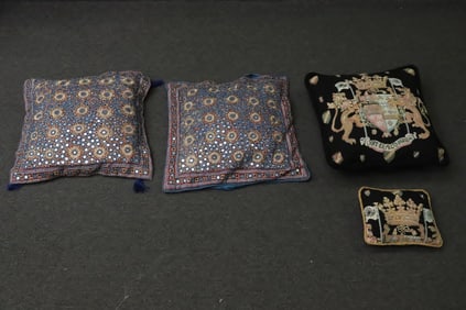 4 pillows w/ embroidery style decoration