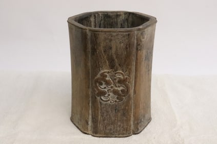 A hexagonal bamboo brush holder