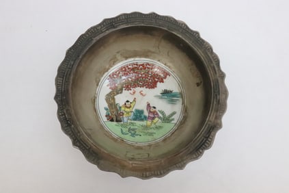 A silver color rimmed porcelain bowl