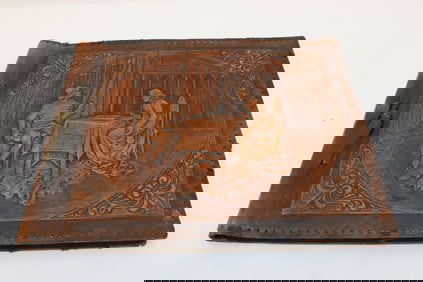 A leather covered photo album w/ photos
