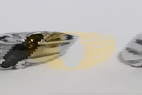 14K Y/G ring, center a black star sapphire cabochon: 14K Y/G ring, center a black star sapphire cabochon, wt. 5.5gm, size 9.5