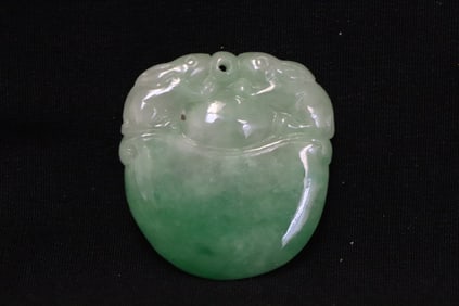 A jadeite carved pendant in the form of fruit