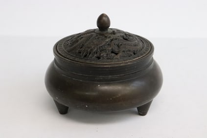 A bronze covered censer