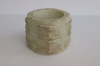 A stone carving in the form of cong