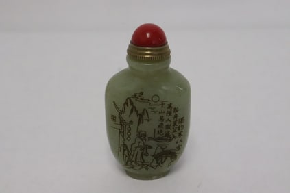 A celadon jade like snuff bottle with calligraphy