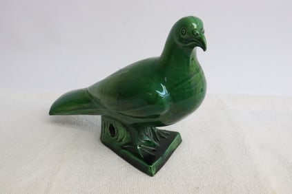 A 19th/20th c. green glazed earthenware sculpture