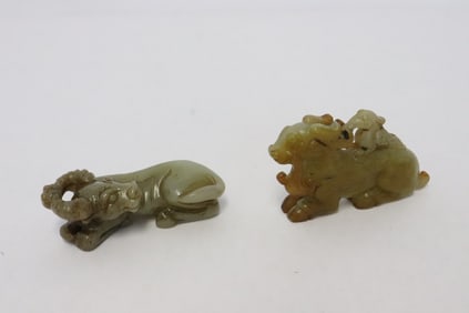 2 stone carved ornaments