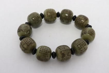 Celadon jade bead bracelet with calligraphy