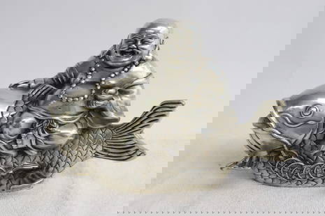 Chinese white metal sculpture: Chinese white metal sculpture depicting Buddha riding on fish, 5.95"H
