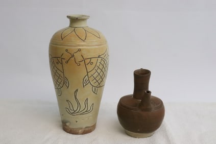 2 earthenware articles; a vase, and a wine server