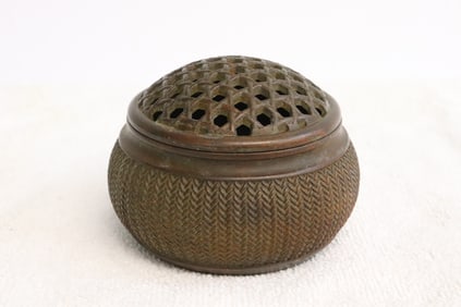 A bronze covered censer