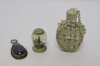 a white bronze scent bottle, a pendant, & a hat finial