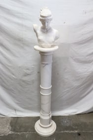 antique marble sculpture on marble pedestal