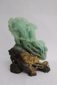 A shoushan stone carving on natural shoushan stone base