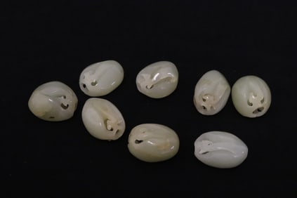 8 Chinese antique very finely carved light celadon jade beads
