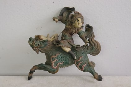 Antique Chinese roof tile depicting warriors on qilin