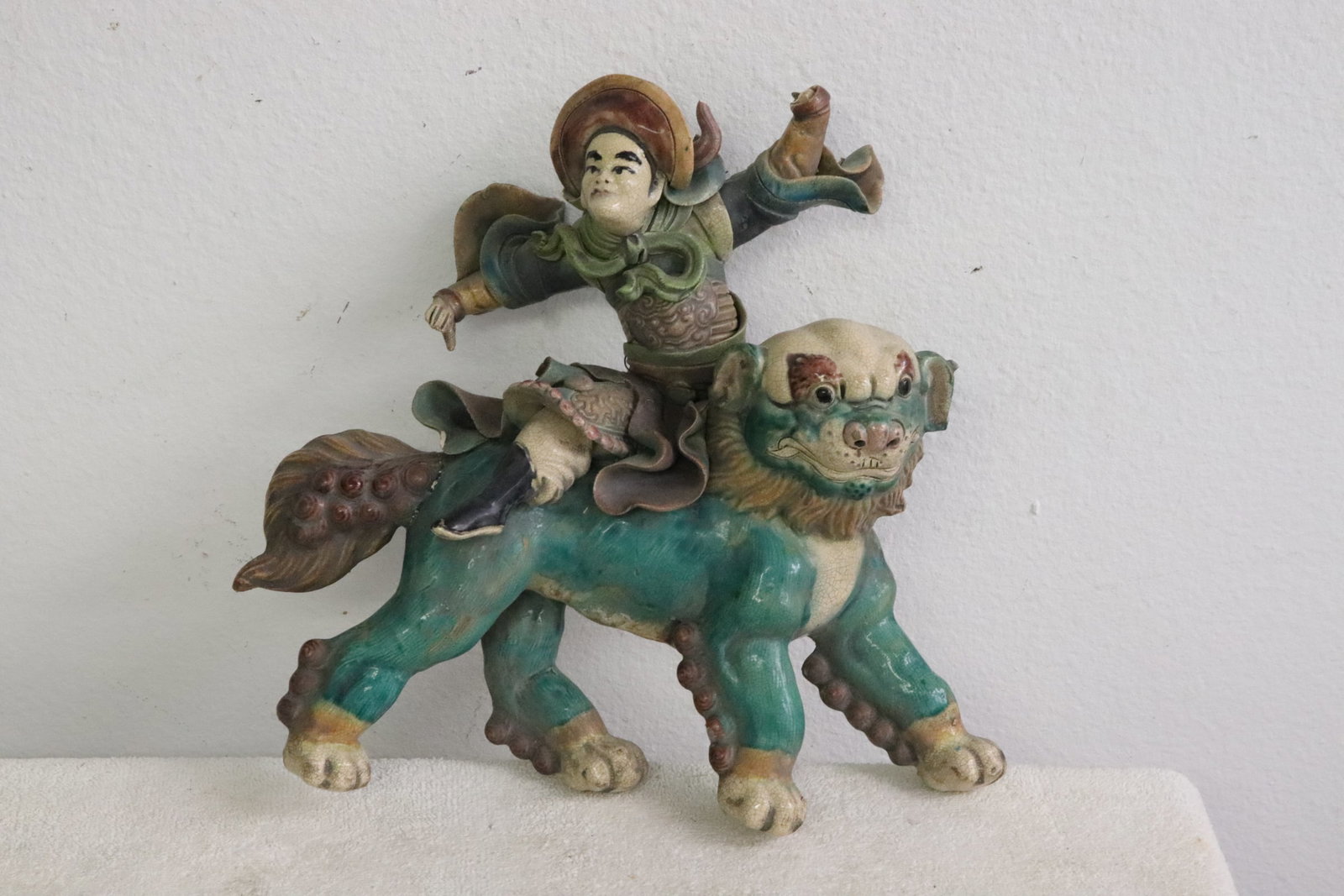 Antique Chinese roof tile depicting warrior on fulion: Antique Chinese roof tile depicting warrior on fulion, chip, 11.7"H