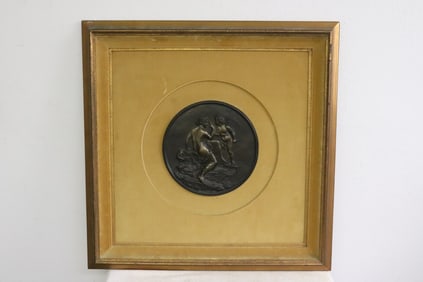 A framed European relief panel