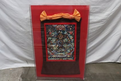 A hand painted thangka with Lucide frame