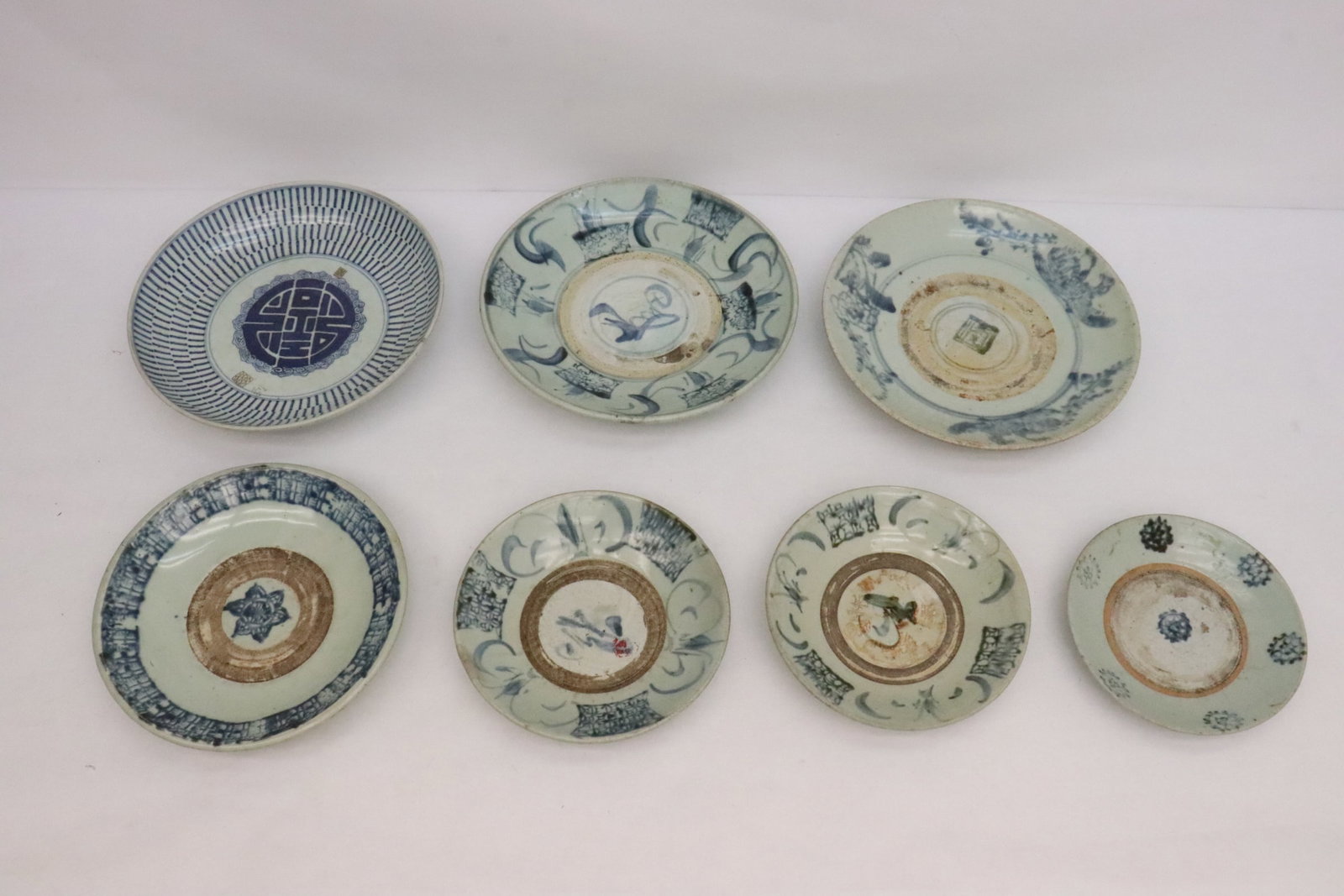 7 pieces Chinese 17th/18th c. export porcelain plates: 7 pieces Chinese 17th/18th century export blue and white porcelain plates, 1.5"x7.4"dia - 2"x11.15"dia