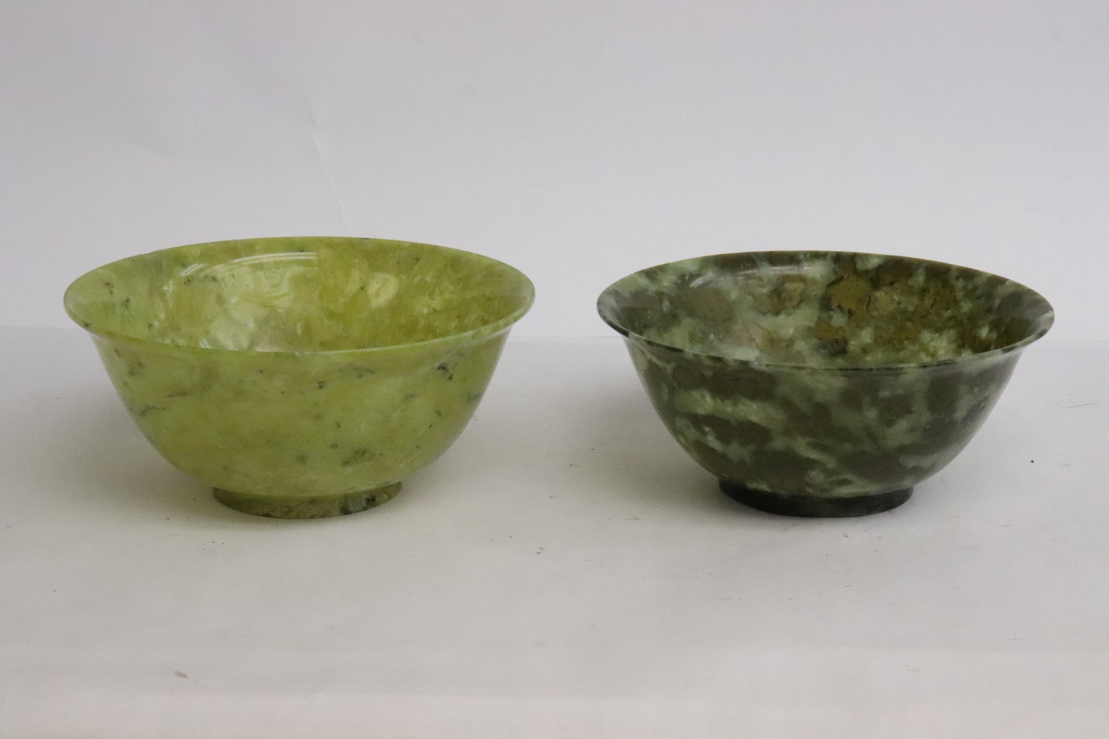 2 spinach jade carved bowls: 2 spinach jade carved bowls, 2.15"x4.9"dia, 2.3"x5.1"dia