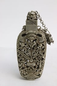 A white bronze scent bottle