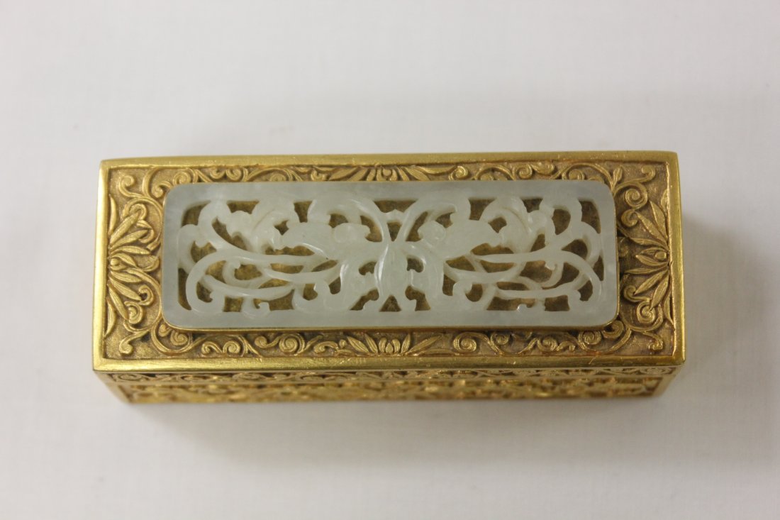 Chinese antique gilt bronze stamp box w/ white jade: Chinese antique gilt bronze stamp box accented by white jade carved plaque, the jade carved in butterfly and floral motif, 1.25"Hx3.6"x1.4"