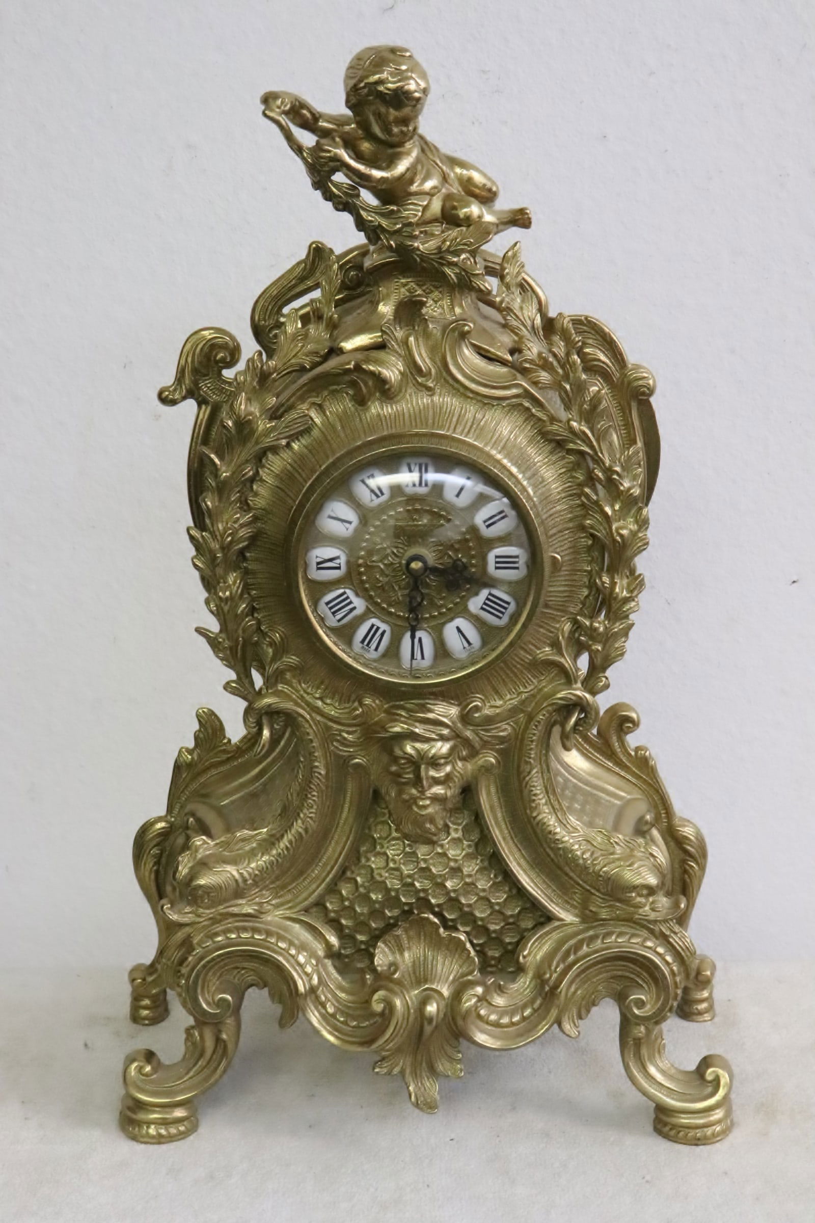 Large brass cased table clock w/ angel motif ainial (1 of 9)