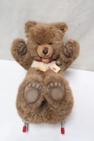 A Steiff bear on wheel